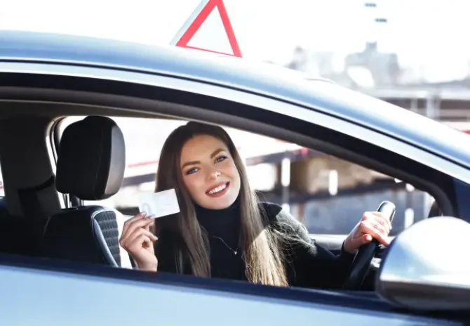 joyful-girl-driving-a-training-car-with-a-drivers-2025-01-08-23-11-05-utc 1